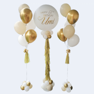 Personalized chrome gold and white helium balloon bouquet with a large custom bubble balloon and matching side bouquets, designed for birthdays and other special occasions.